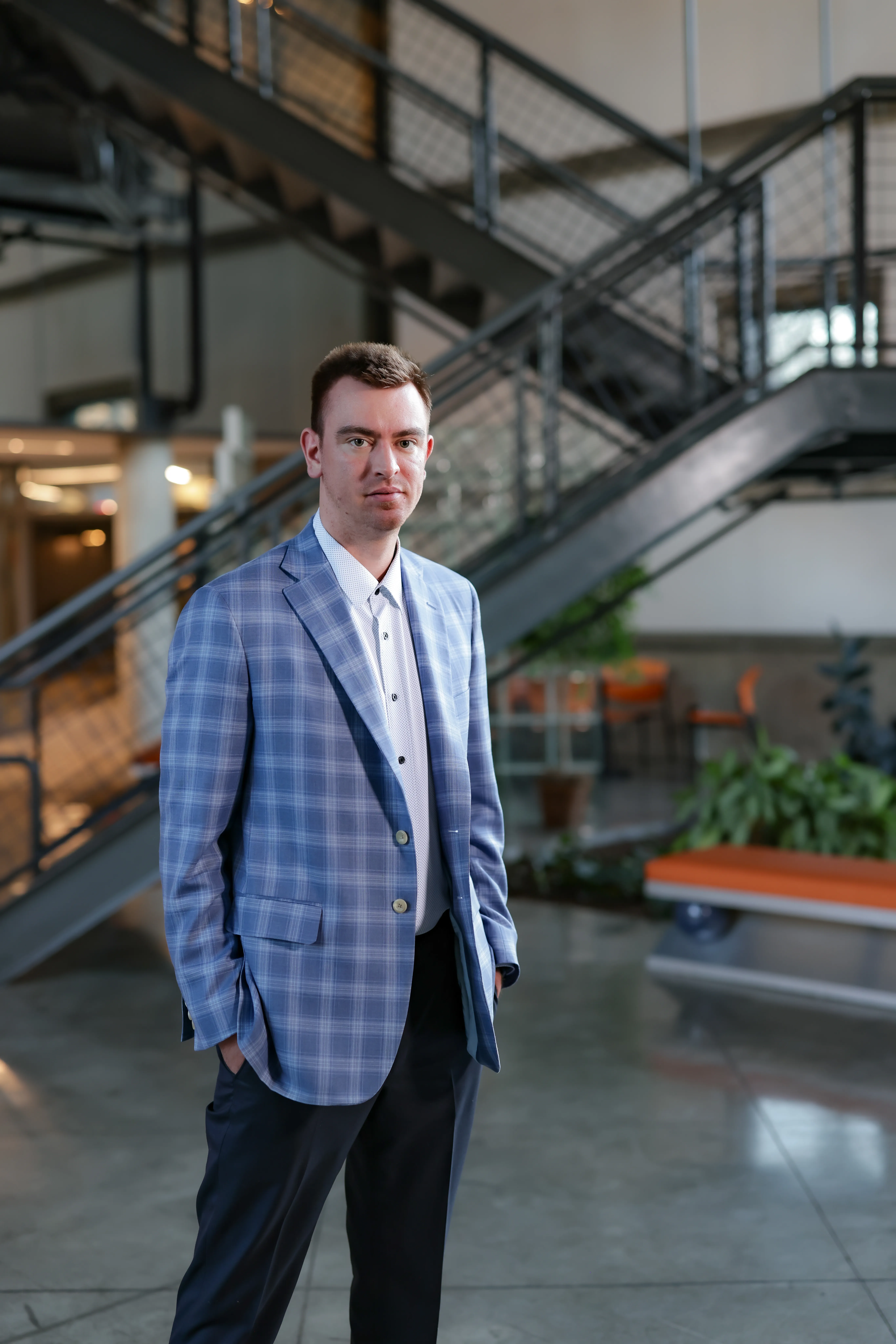 Jared Fracker, founder of Command Center Consulting, photographed in a modern industrial lobby in Cincinnati